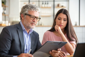 man reading article about california long-term care tax 2024